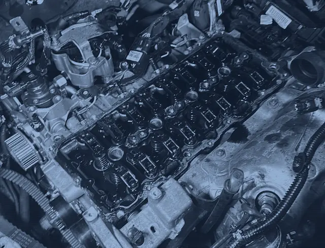 Engine with the rocker cover removed during a repair in our workshop