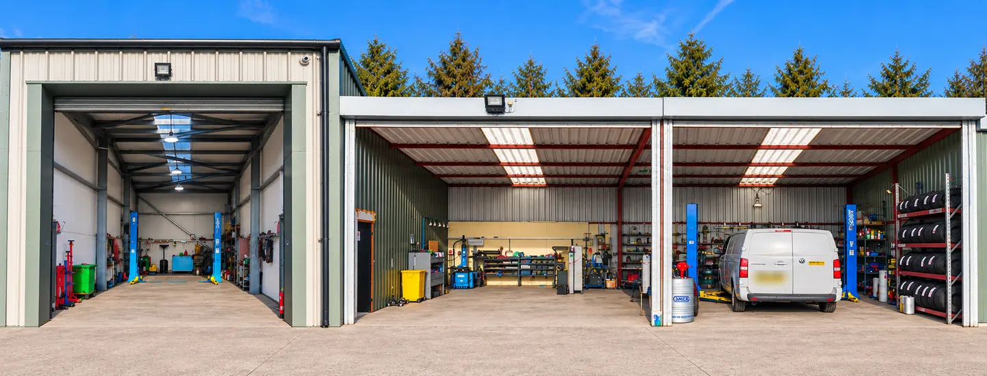 The workshop bays at NRH Autoworks in Bray, Maidenhead, with vehicle lifts and tyre racks
